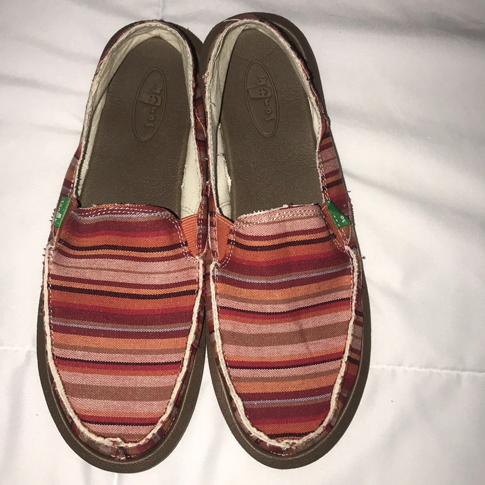 Sanuk slip on shoes. Colorful stripped.
